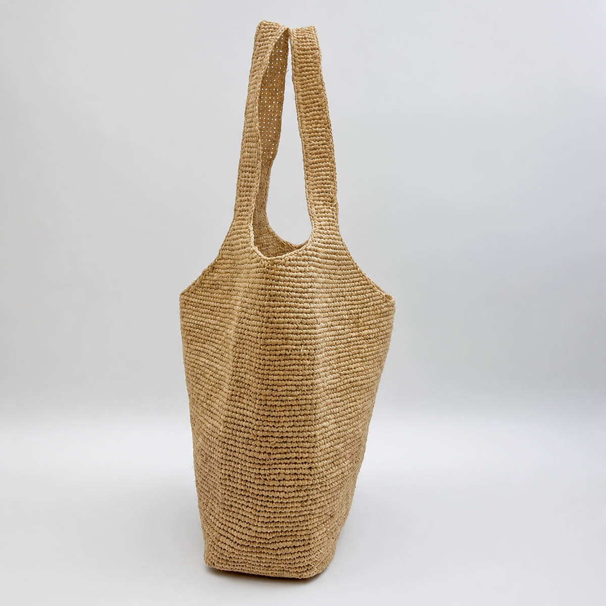 Marlowe Large Crochet Resort Tote — side view of Tiger Canada handwoven raffia bag
