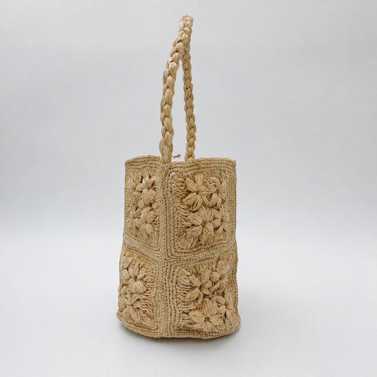 Fleur 3D Raffia Bucket Bag — side view of Tiger Canada handwoven raffia bag