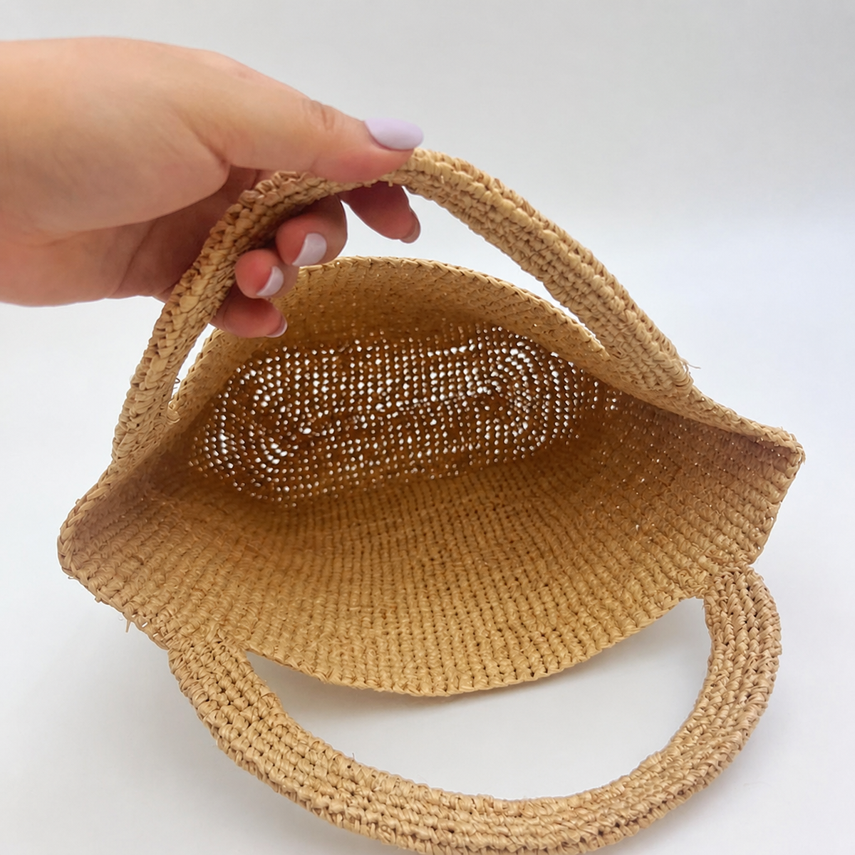 Isla Raffia Straw Clutch — interior and construction detail of Tiger Canada handwoven raffia bag