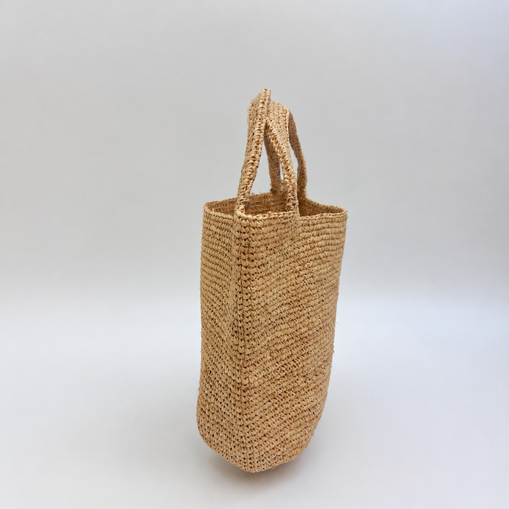 Isla Raffia Straw Clutch — side view of Tiger Canada handwoven raffia bag