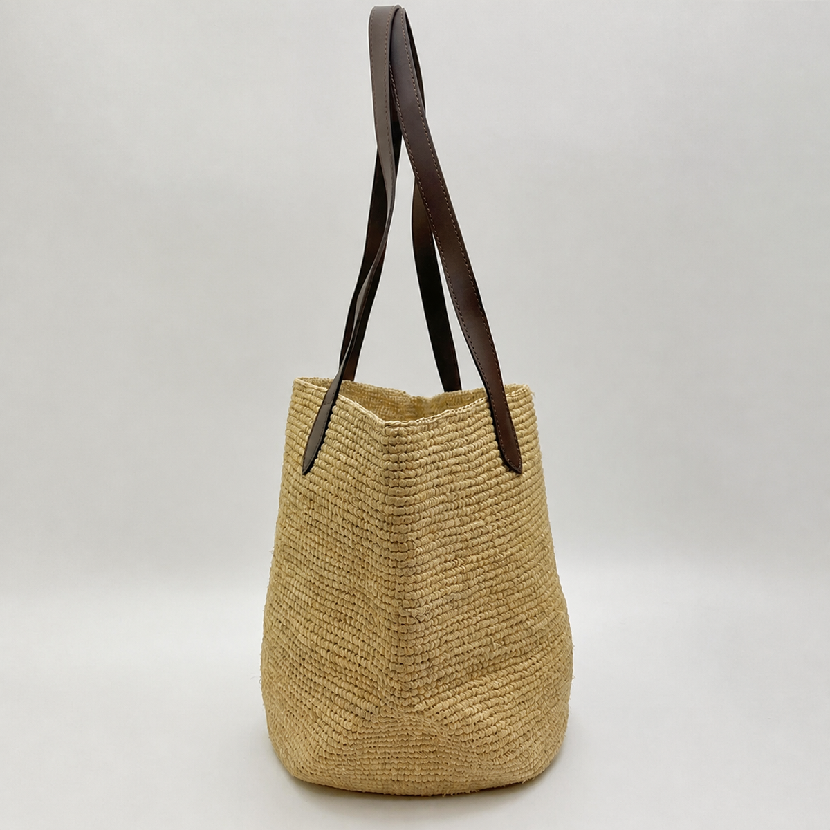 Mercer Large Leather-Strap Raffia Tote — side view of Tiger Canada handwoven raffia bag
