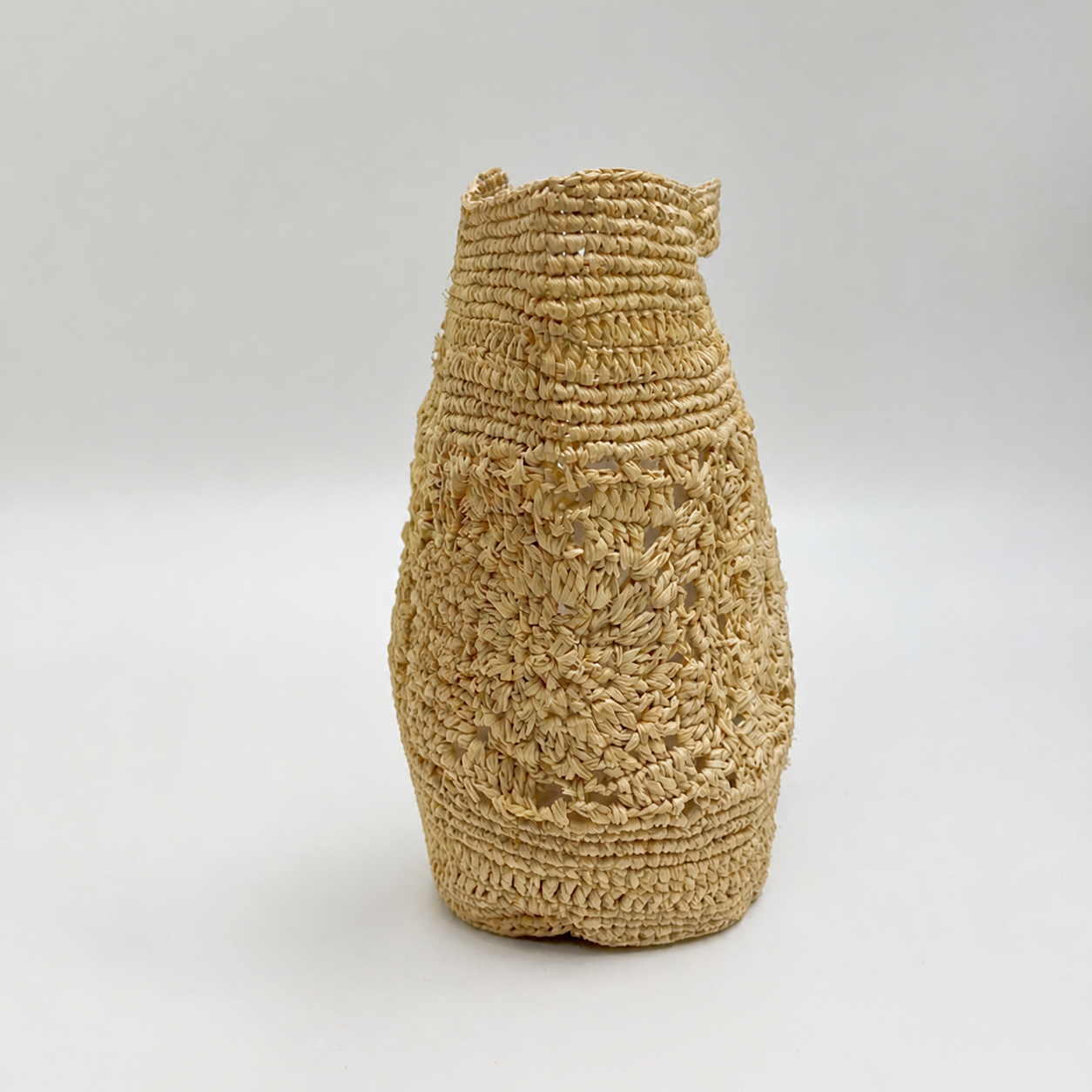 Lattice Mini Hollow-Weave Bag — side view of Tiger Canada handwoven raffia bag