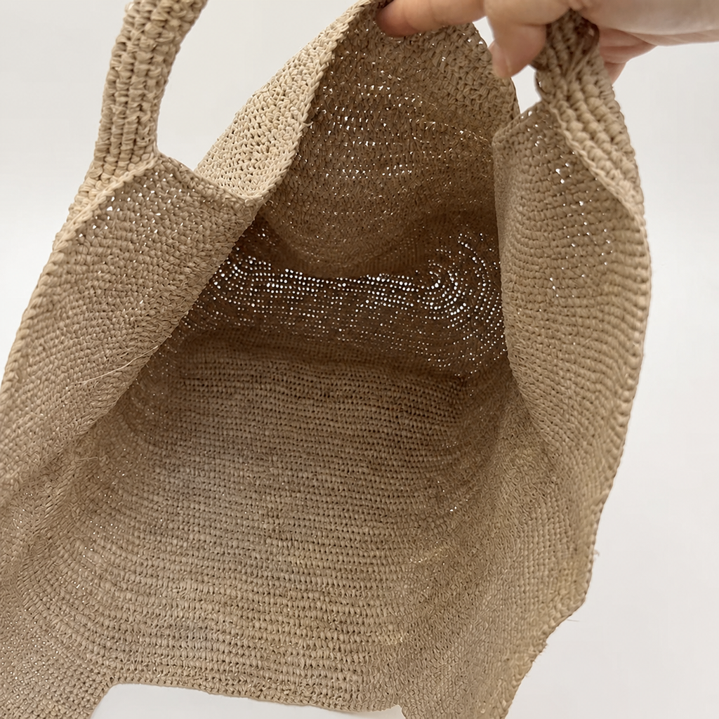 Grande Raffia Carryall — interior and construction detail of Tiger Canada handwoven raffia bag