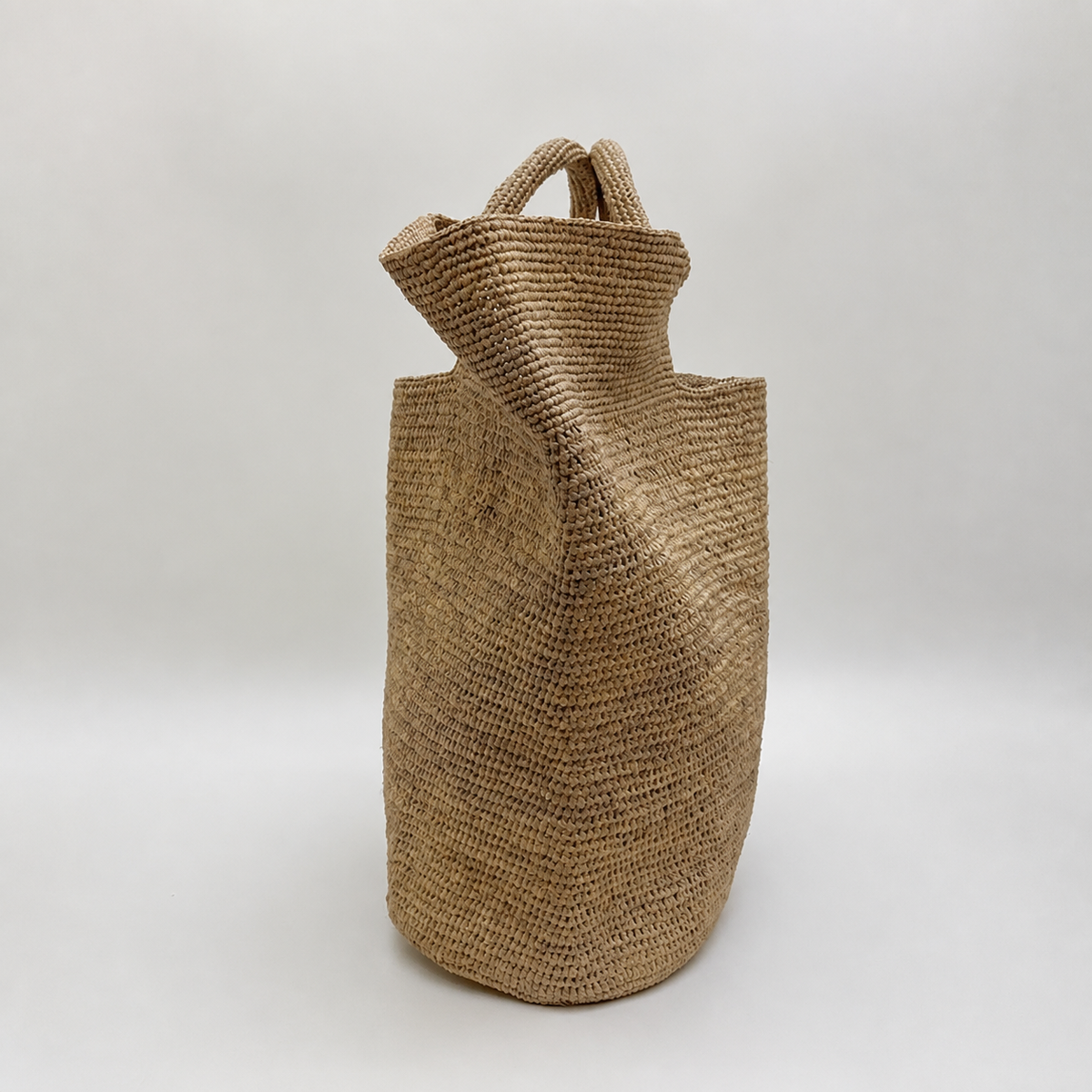 Grande Raffia Carryall — side view of Tiger Canada handwoven raffia bag