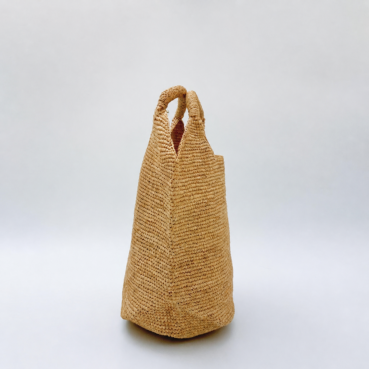 Elara Raffia Shoulder Tote — side view of Tiger Canada handwoven raffia bag