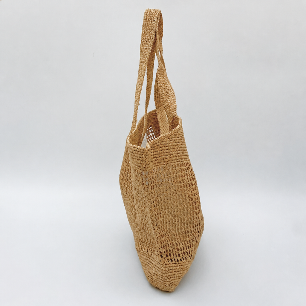 Riviera Boho Raffia Tote — side view of Tiger Canada handwoven raffia bag
