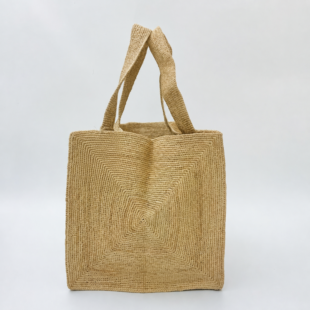 Meadow Minimalist Raffia Tote — side view of Tiger Canada handwoven raffia bag