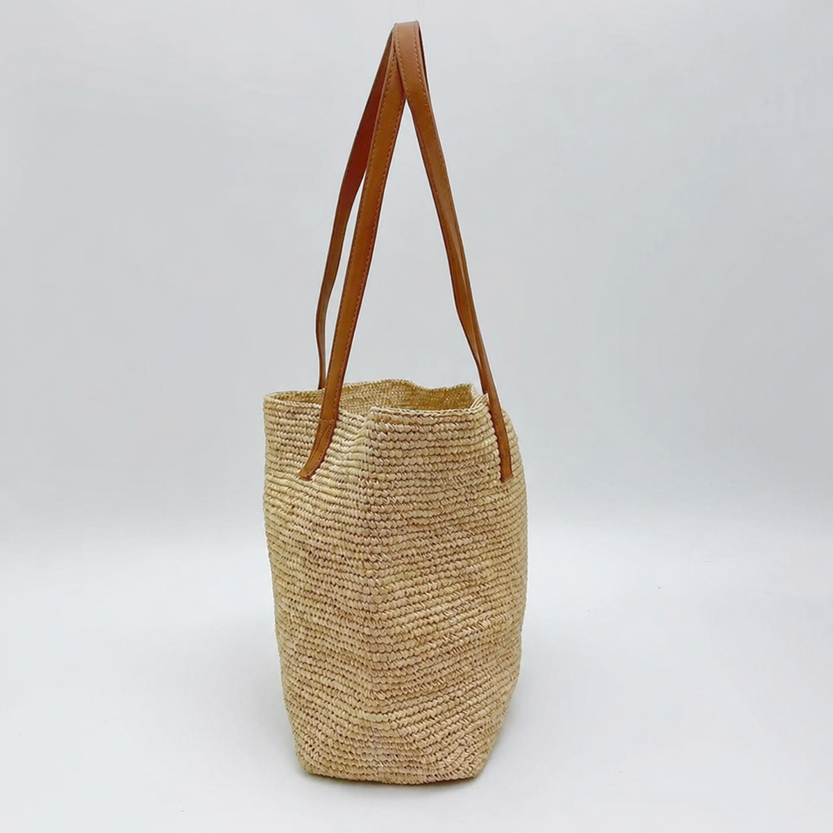 Wren Large Leather-Strap Raffia Tote — side view of Tiger Canada handwoven raffia bag