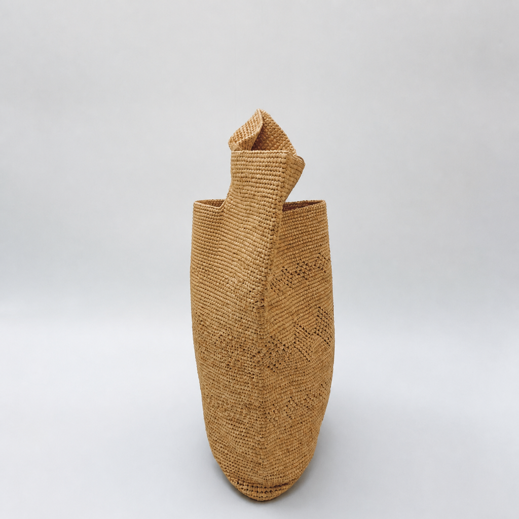 Coastline Raffia Beach Tote — side view of Tiger Canada handwoven raffia bag