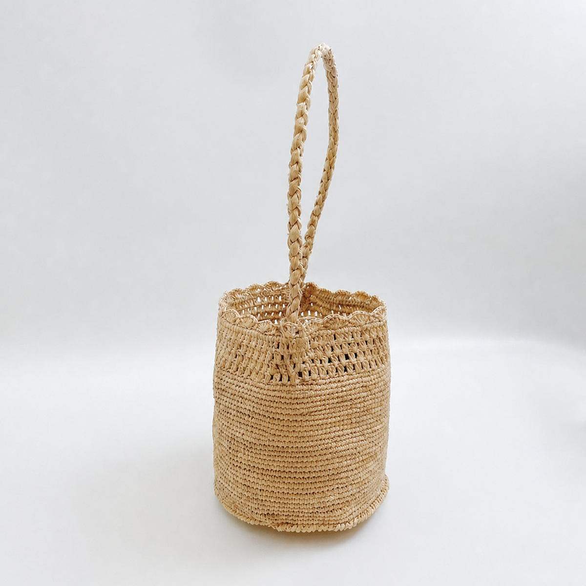 Belle Raffia Bucket Bag — side view of Tiger Canada handwoven raffia bag