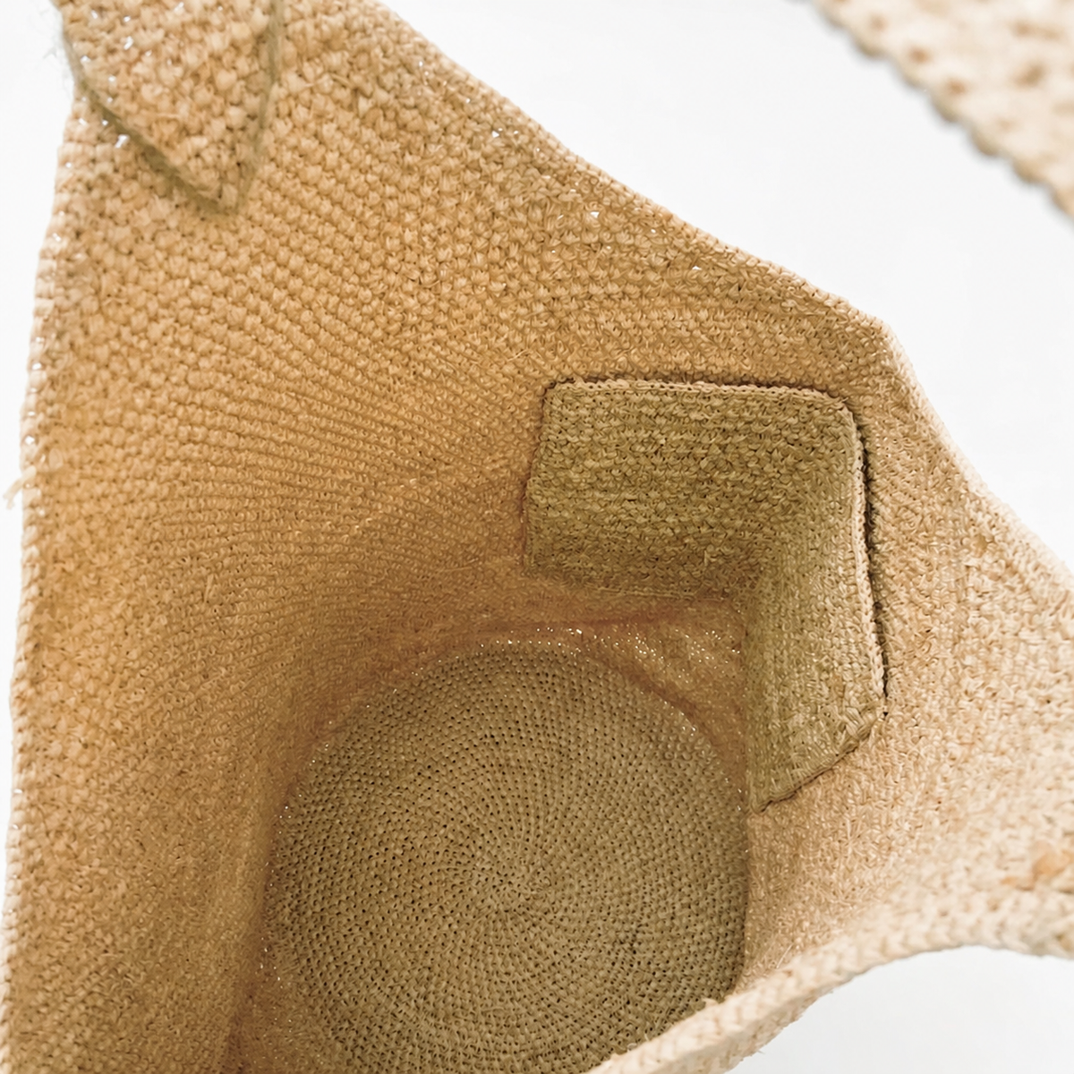 Drift Lightweight Raffia Bucket Bag — interior and construction detail of Tiger Canada handwoven raffia bag