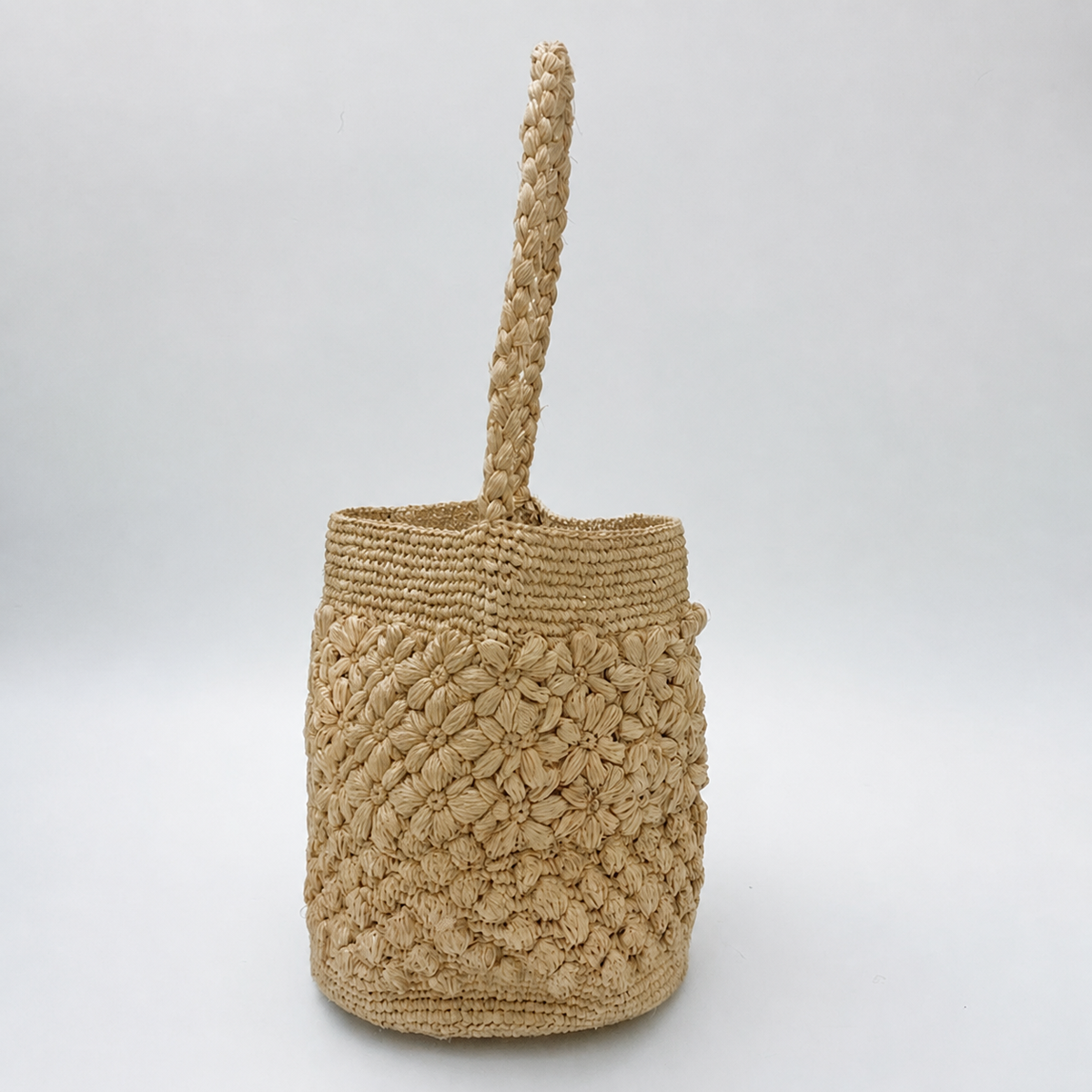 Bloom Crochet Raffia Bucket Bag — side view of Tiger Canada handwoven raffia bag